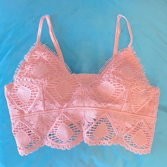 Pink lace crop top with adjustable straps and removable pads. - Picture 1 of 3